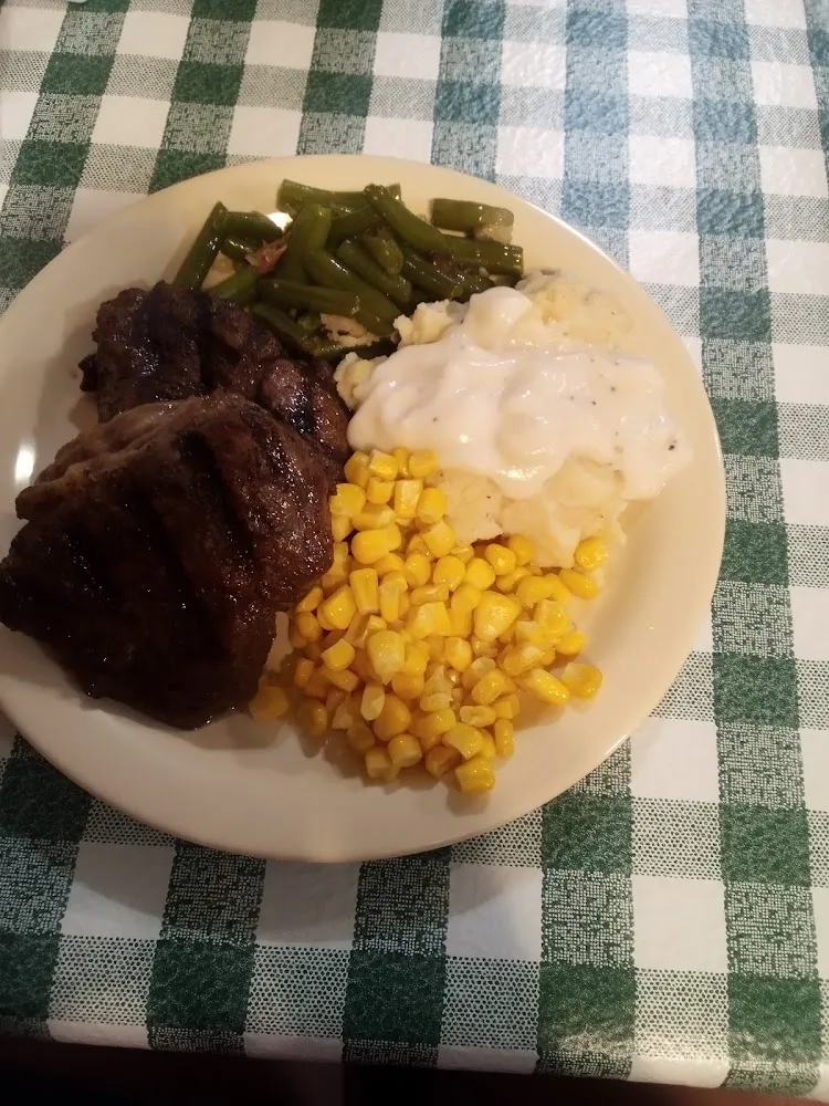 Buffet Sirloin Steak with Mashed Potatoes and Gravy with Corn