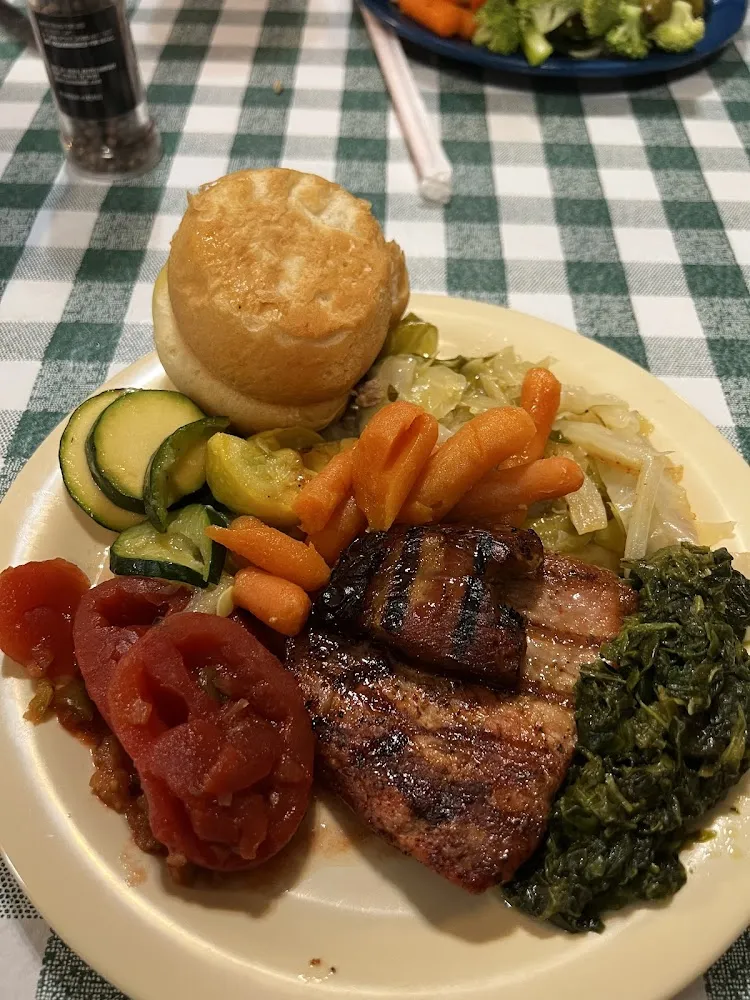 Roll Ham Pork Chop Stewed Tomatoes Greens Sautéed Cabbage